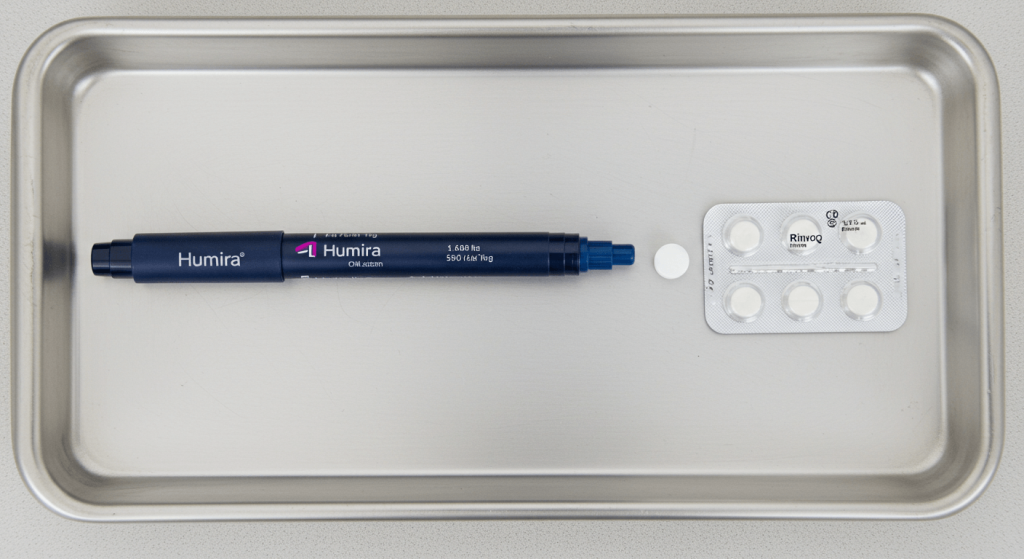 Differences between Humira and Rinvoq shown with injection and pill on white tray
