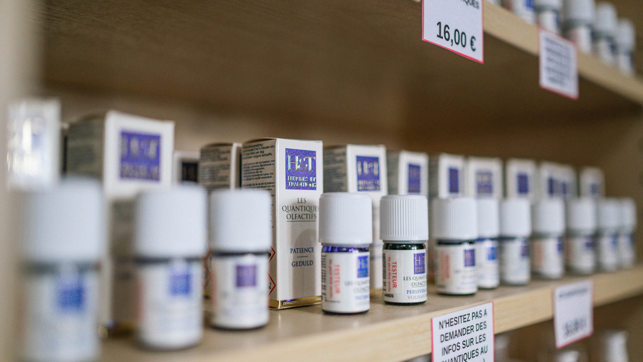 Pharmacy shelves where Humira biosimilars and other prescription medications are dispensed