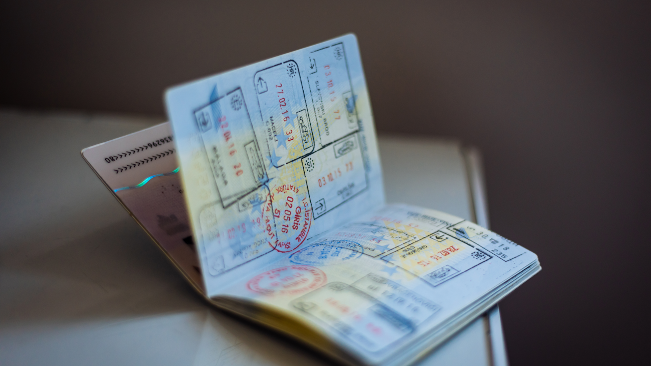 A passport with border stamps and a boarding pass, part of the documentation to bring prescription drugs from Mexico